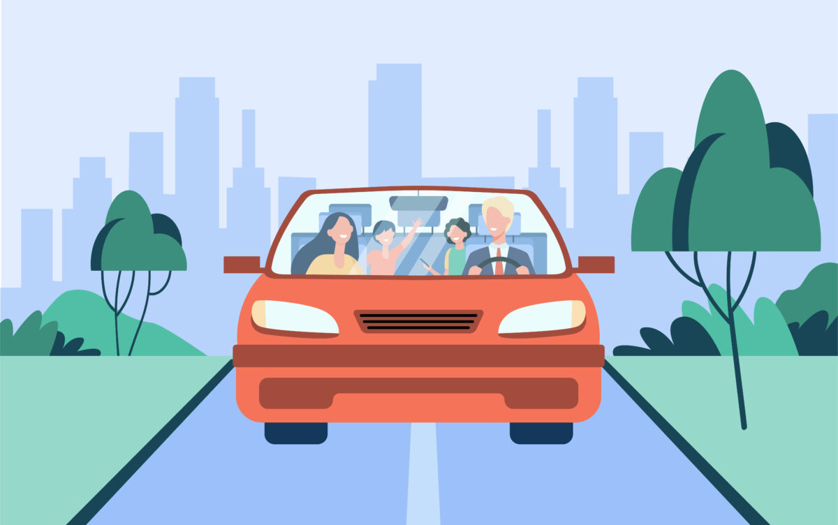 Happy family couple and two kids riding in car
