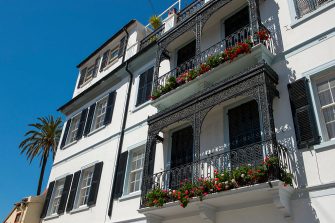 GIBRALTAR - 2015/04/01: A local house with wrought iron balcony and flowers in Gibraltar, which is a British Overseas Territory, located on the southern end of the Iberian Peninsula. (Photo by Wolfgang Kaehler/LightRocket via Getty Images)
