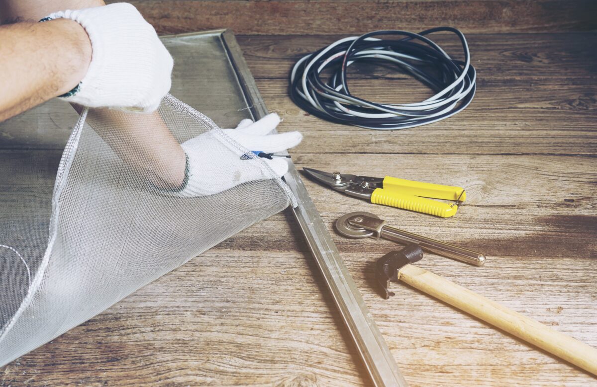 man-is-working-with-mosquito-wire-screen-installation-min